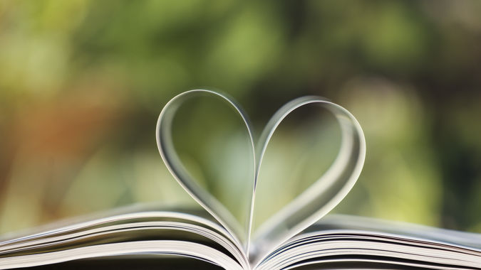 Heart shape made from book pages, selective focus